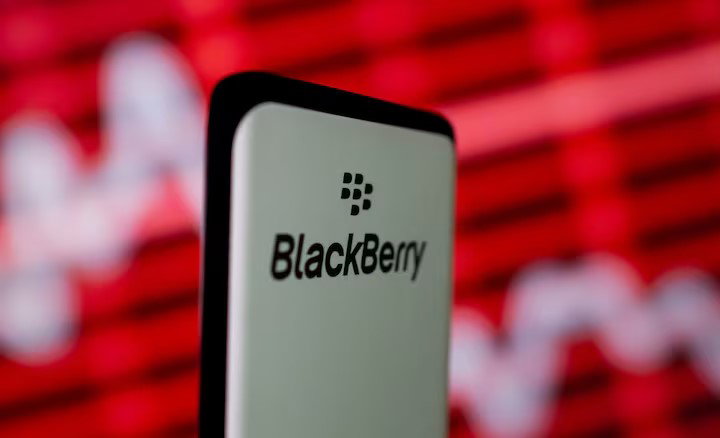 TechDogs-"What Did BlackBerry Update In Its Forecast?"-"BlackBerry Logo Displayed Against Red Market Graph Background Representing Cybersecurity Growth And Financial Performance"
