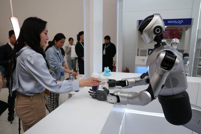 TechDogs-"How China Is Using Humanoid Robots Today?"-"An Image Showing A Kuavo-5W humanoid robot by Leju Robotics Passes Coffee"