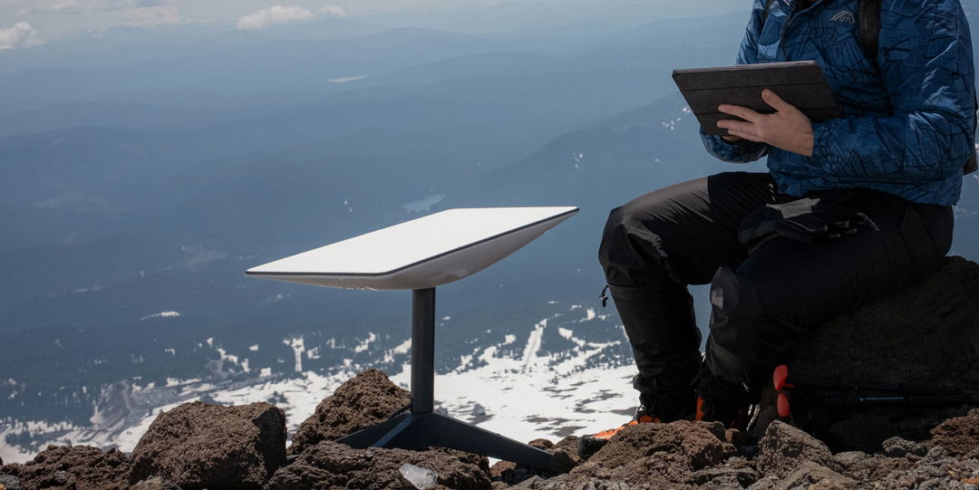 TechDogs-"An Image Of A Person Using Starlink's Space Satellite Services"