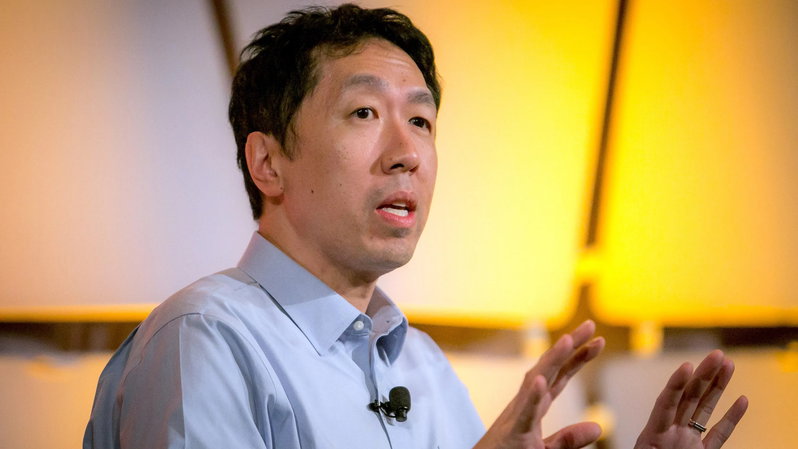 TechDogs-"Poor Data Quality And Data Readiness"-"Andrew Ng Speaking About AI And Machine Learning At A Conference, With A Yellow Background"