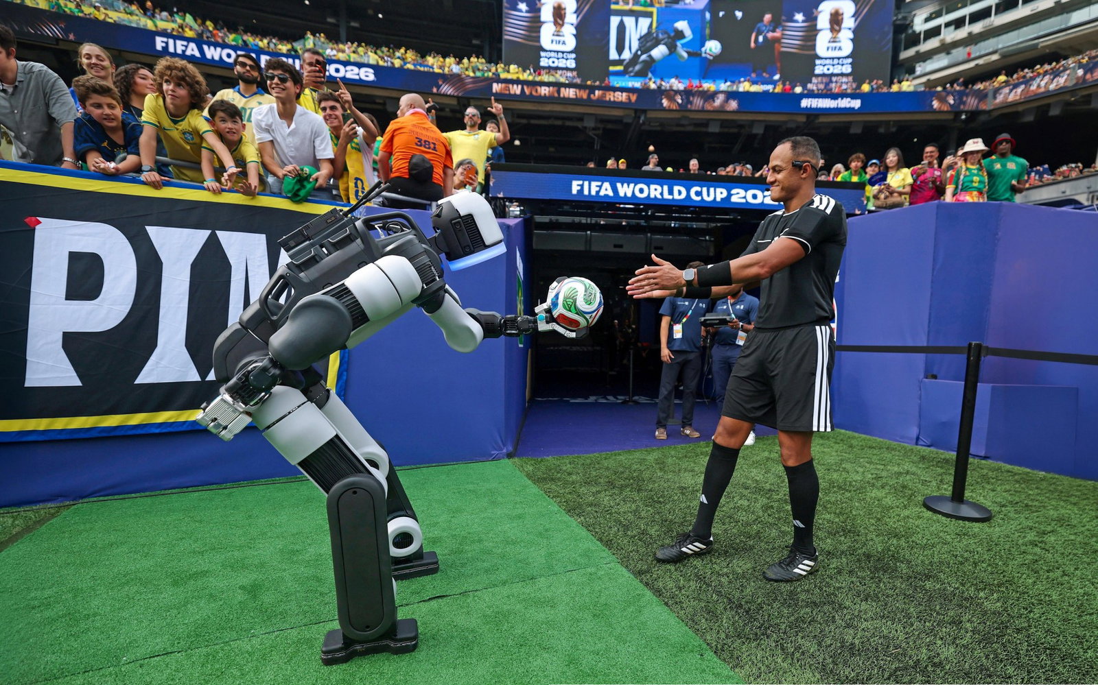 TechDogs-"Why Grass And Stadium Connectivity Changed The Plan"-"An Image Of Boston Dynamics' Atlas Humanoid Robot At The FIFA World Cup"