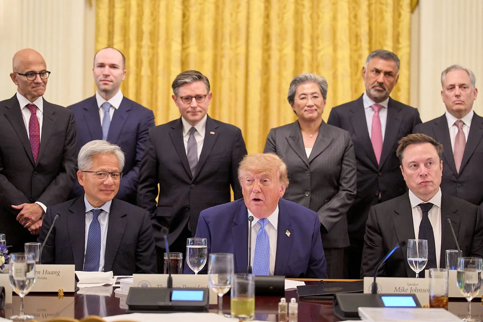 TechDogs-"Which AI Leaders Attended The White House Meeting And What Did They Say?"-"An Image Of President Donald Trump At The Signing Of The Executive Order "Inaugurating The Era Of Super Intelligence" Along With Satya Nadella, Jensen Huang, Elon Musk, And Others "