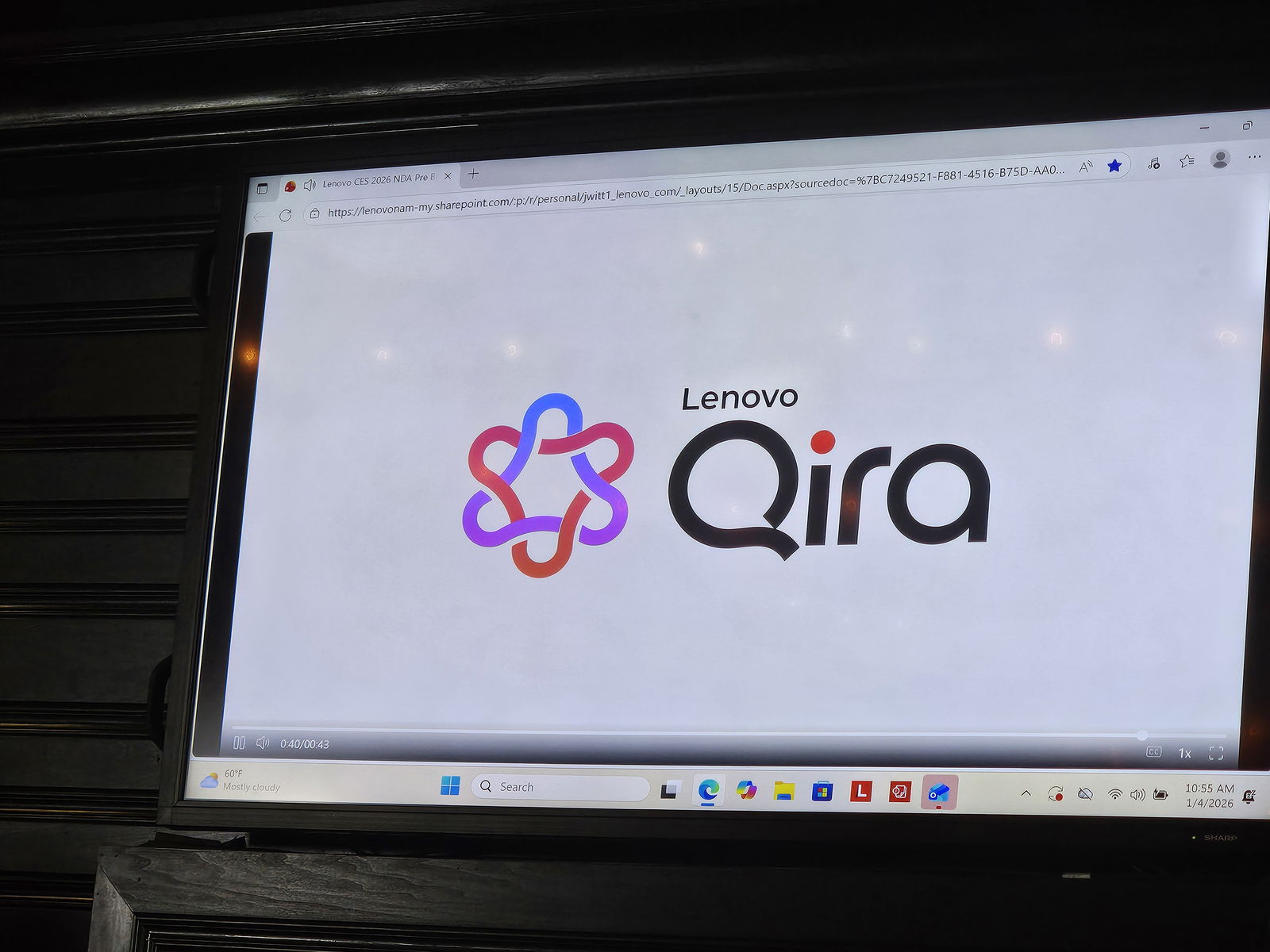 TechDogs-"Lenovo Qira AI assistant logo displayed during CES 2026 launch presentation highlighting Lenovo’s cross-device AI ecosystem."