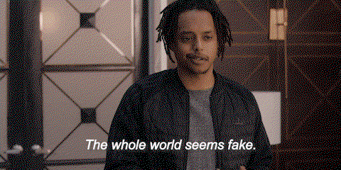 TechDogs-"How Can AI Spot Fake Reviews?"-"A Gif With A Text - The Whole World Seems Fake"