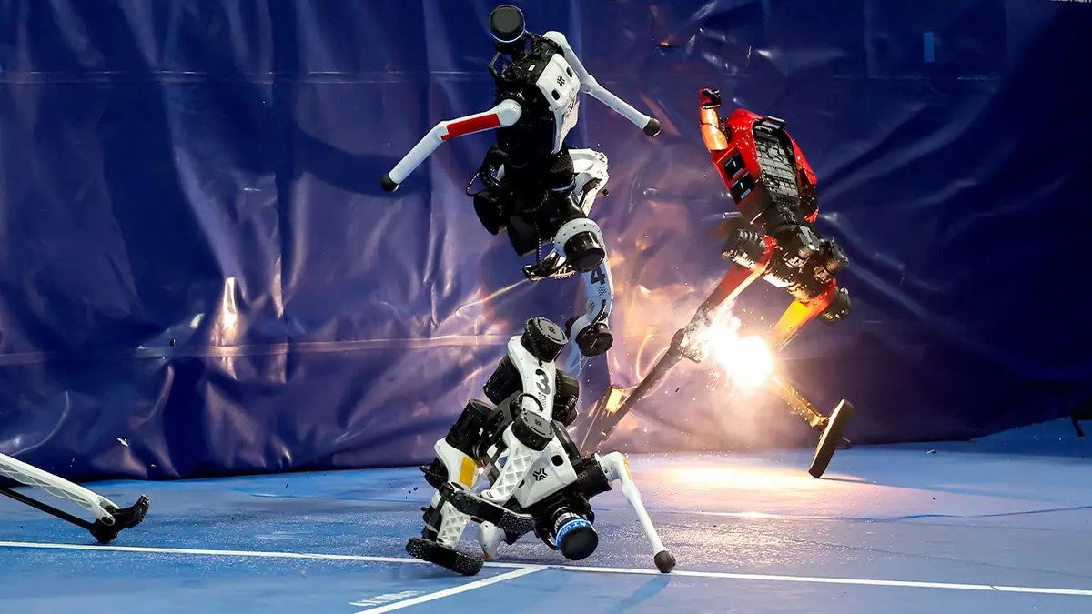 TechDogs-"Who Won And What Records Were Set At World Humanoid Robot Games 2026?"-"An Image Of Robots Crashing Into Protective Barriers And Falling And Sparking During The World Humanoid Robot Games 2026"