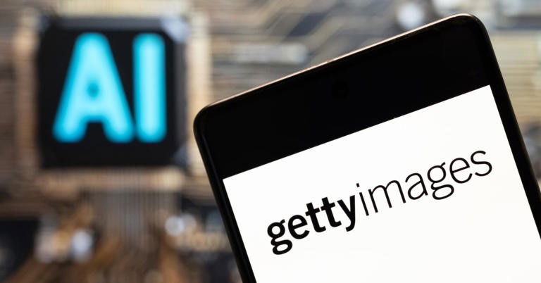 TechDogs-"An Image Showing A Phone With The Getty Images Logo And AI Visible In The Background"