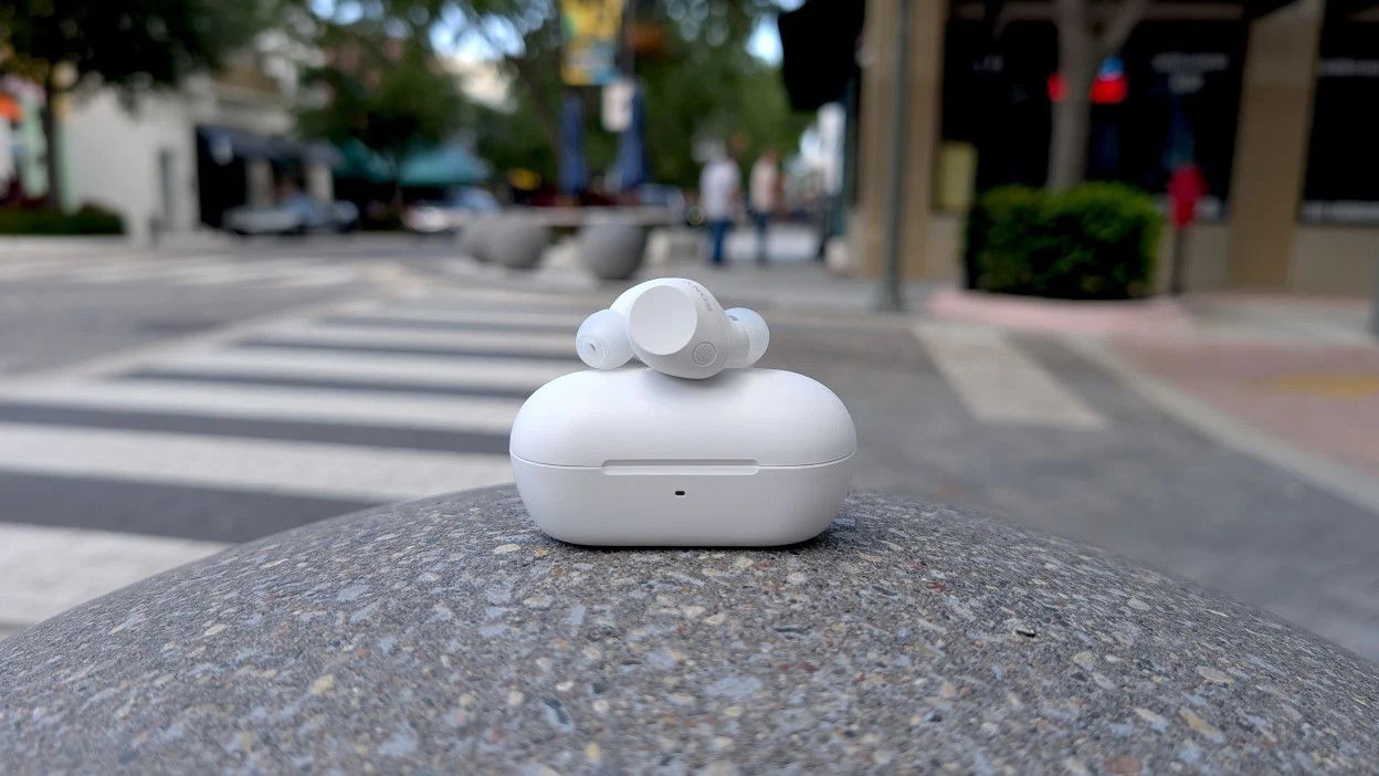 TechDogs-"Sony WF-C710N"-"White Sony WF-C710N Earbuds On Case Outdoors."