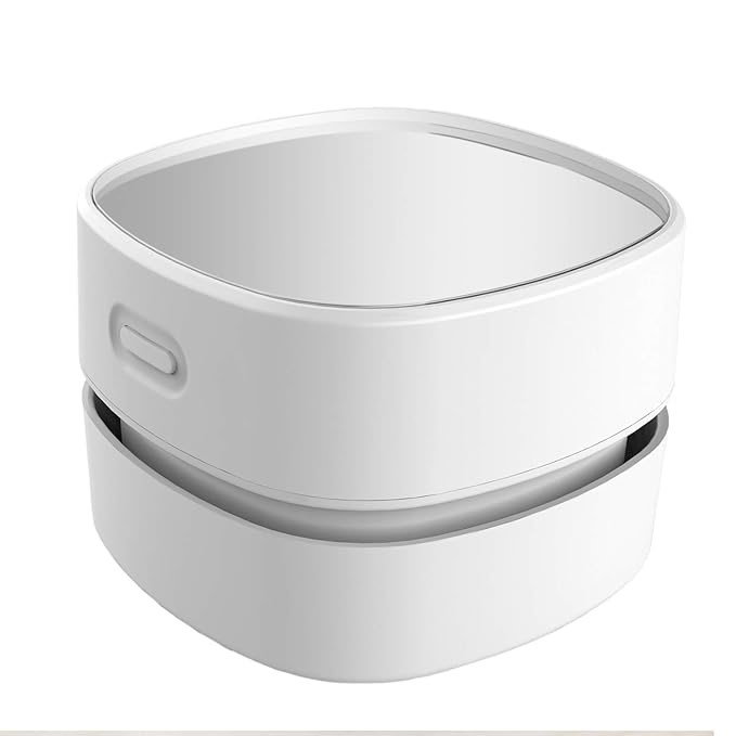 TechDogs-"Mini Desk Vacuum: The Gadget That Saves Your Desk After Snack Breaks"-"Image Of ODISTAR Desktop Vacuum Cleaner"