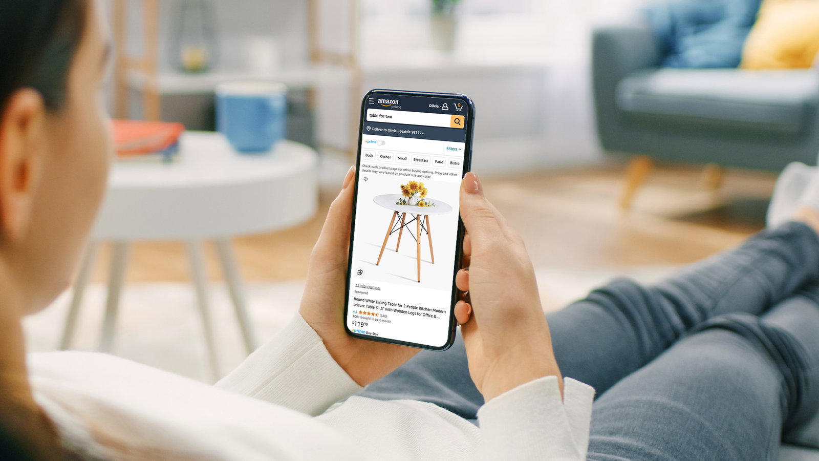 TechDogs-"An Image Of A Person Using Amazon's App And Its AI Features"