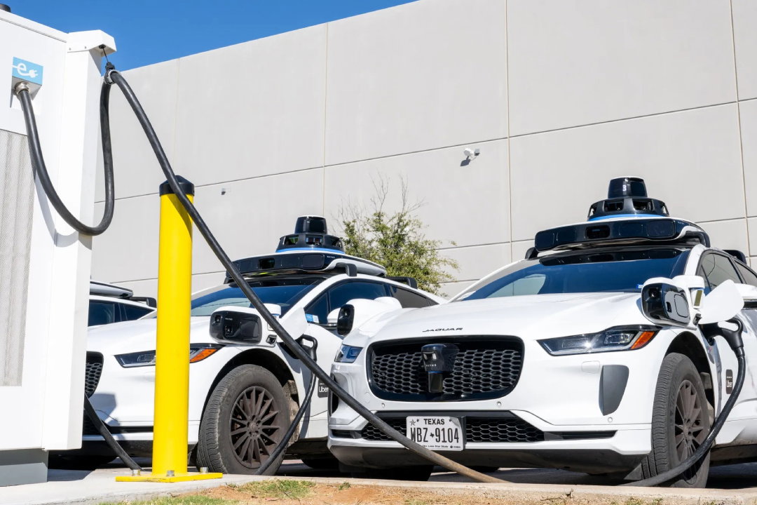 TechDogs-"An Image Of An Uber Robotaxi At A Charging Station"