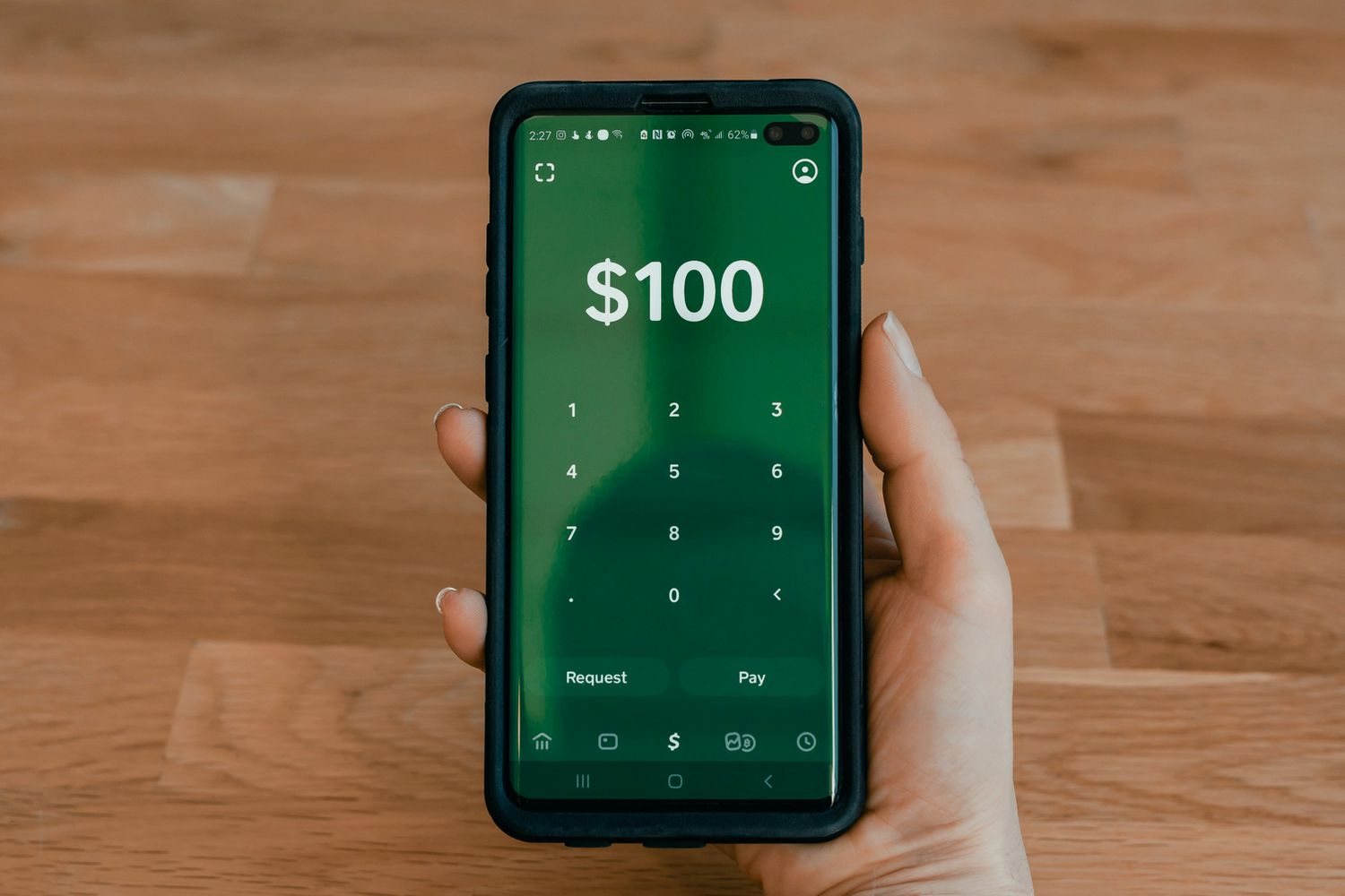 TechDogs-"An Image Of A Person Using Cash App"