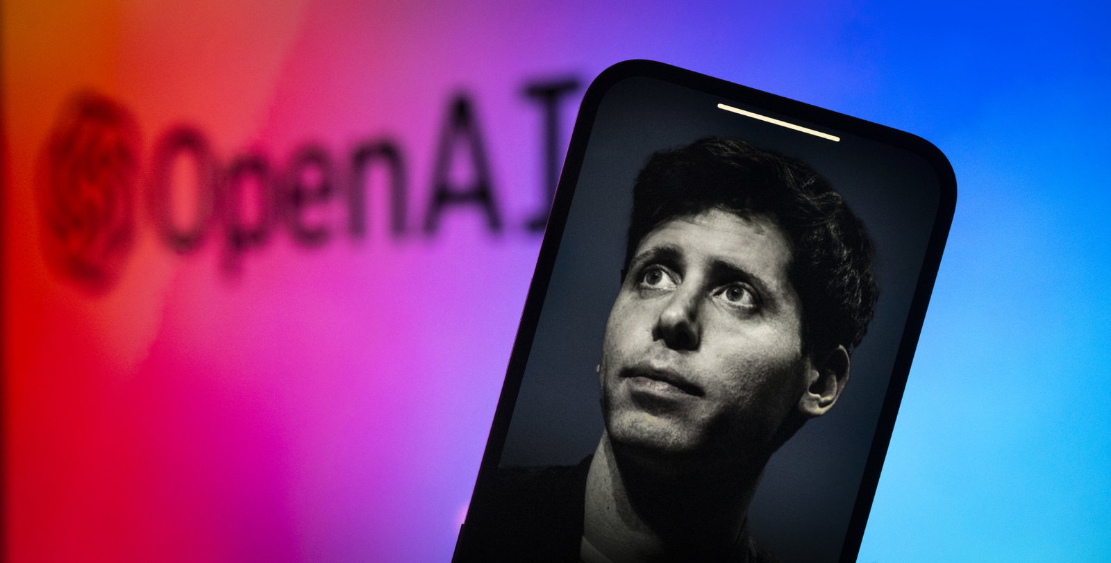 TechDogs-"An Image Of OpenAI CEO Sam Altman And The OpenAI Logo"