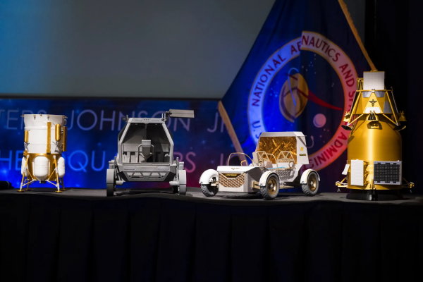 TechDogs - "An Image Showing NASA Moon Base Rover And Lander Models"