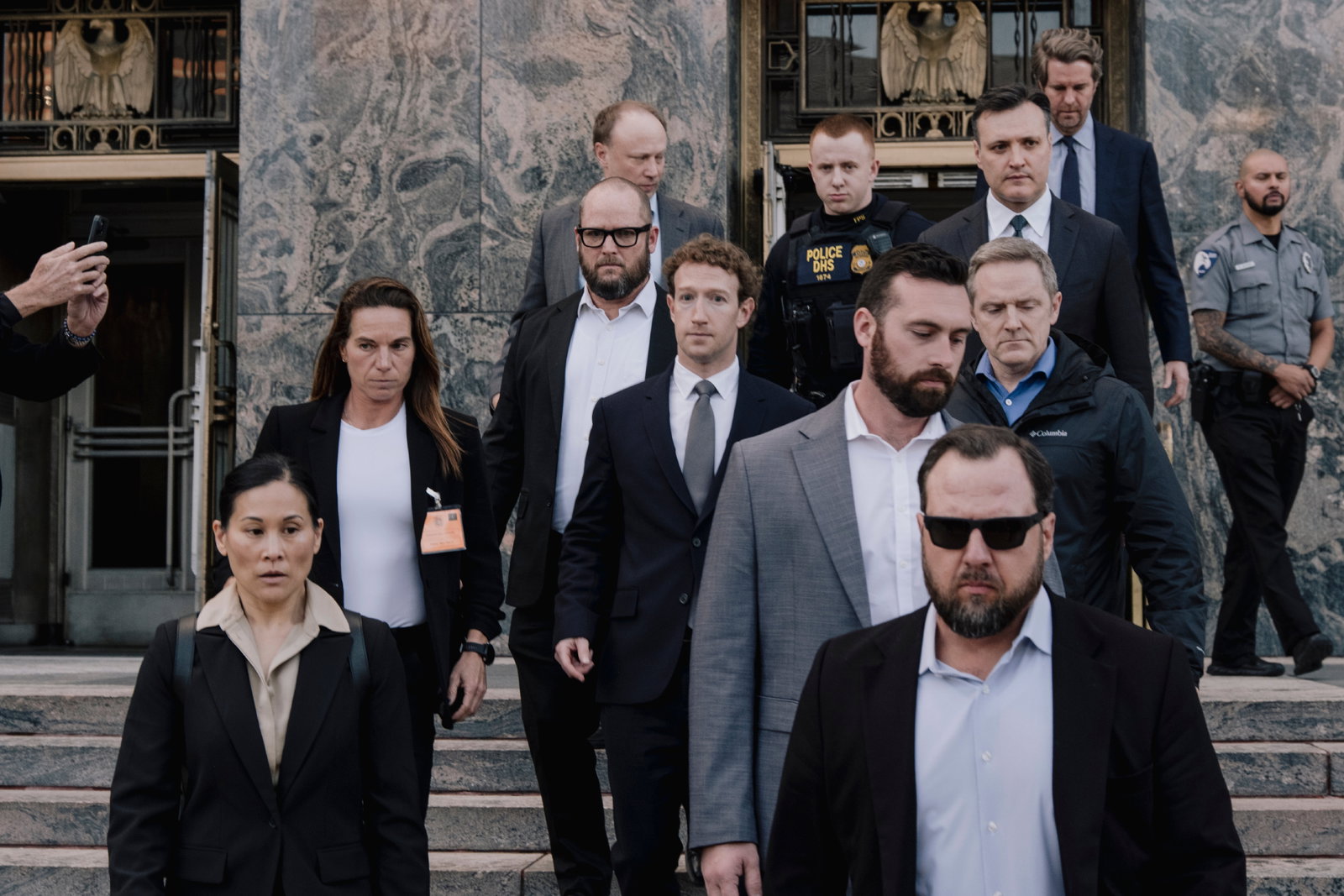 TechDogs-"An Image Of A Meta CEO Mark Zuckerberg Exiting A Courthouse After Facing A Loss In A Teen Safety Lawsuit"