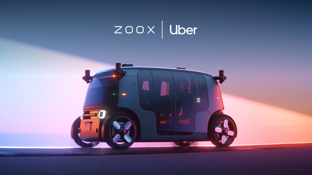 TechDogs-"An Image Of A Zoox Robotaxi With The Logos Of Zoox And Uber"