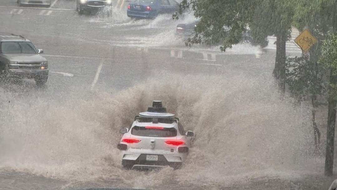 TechDogs-"An Image Of The Waymo Robotaxi Entering The Flooded Area"