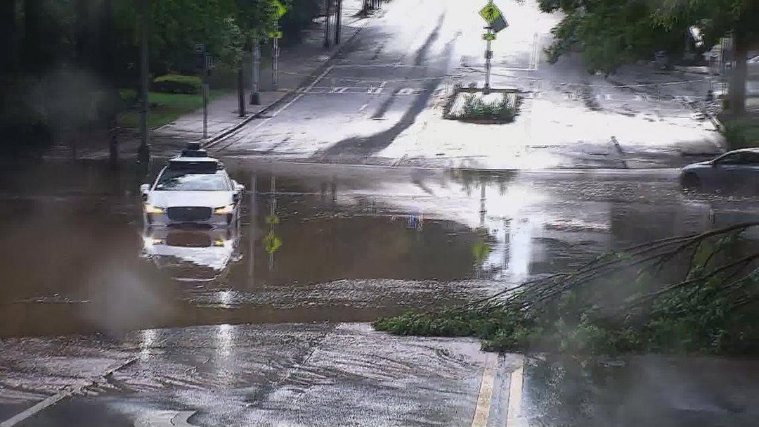 TechDogs-"An Image Of The Waymo Robotaxi Stuck In The Flooded Area"